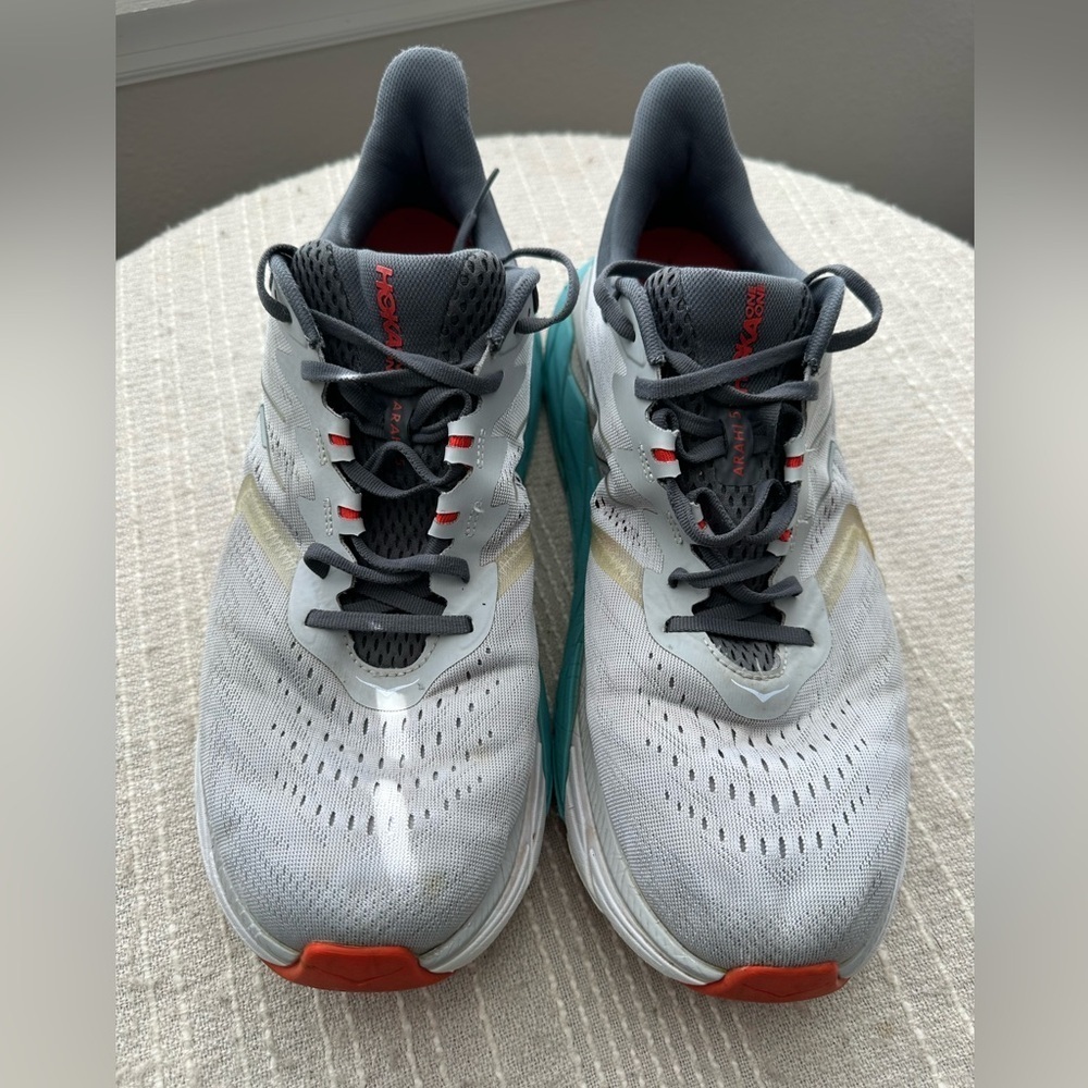 Hoka Gray and Teal Running Shoes with Red Accents